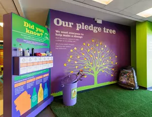 Gillmoss Recycling Discovery Centre with colourful walls and artificial grass