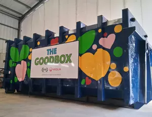 Green shaded border surrounding a blue container painted with pink green and yellow hearts and leaves.