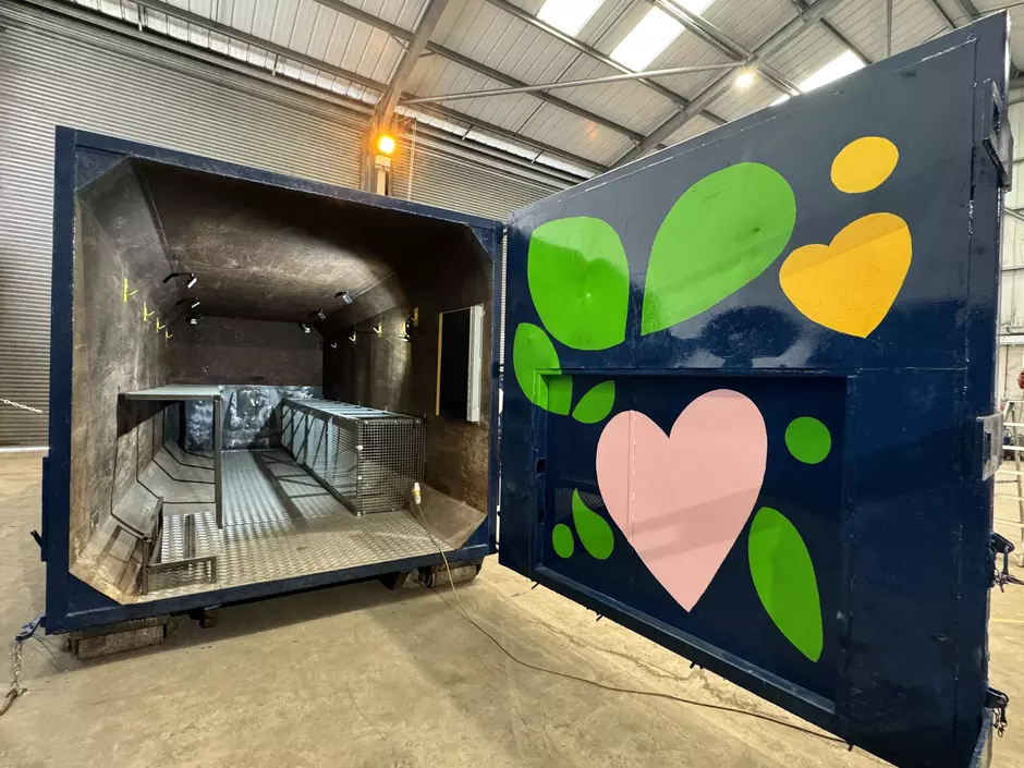 View of the GoodBox container internal shelving hooks and chalkboard. 