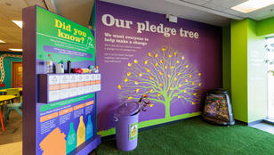 Gillmoss Recycling Discovery Centre with colourful walls and artificial grass